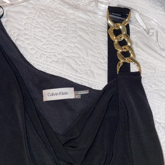 Calvin Klein Dresses & Skirts - Calvin Klein little black dress with gold embellished shoulder.
